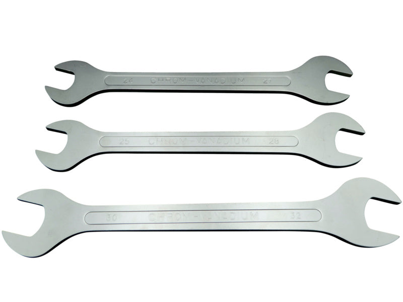 Set of double-ended wrenches in various sizes arranged on a white background.