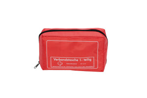 Rote Verbandtasche mit kompaktem Design und Erste-Hilfe-Materialien für Notfälle.