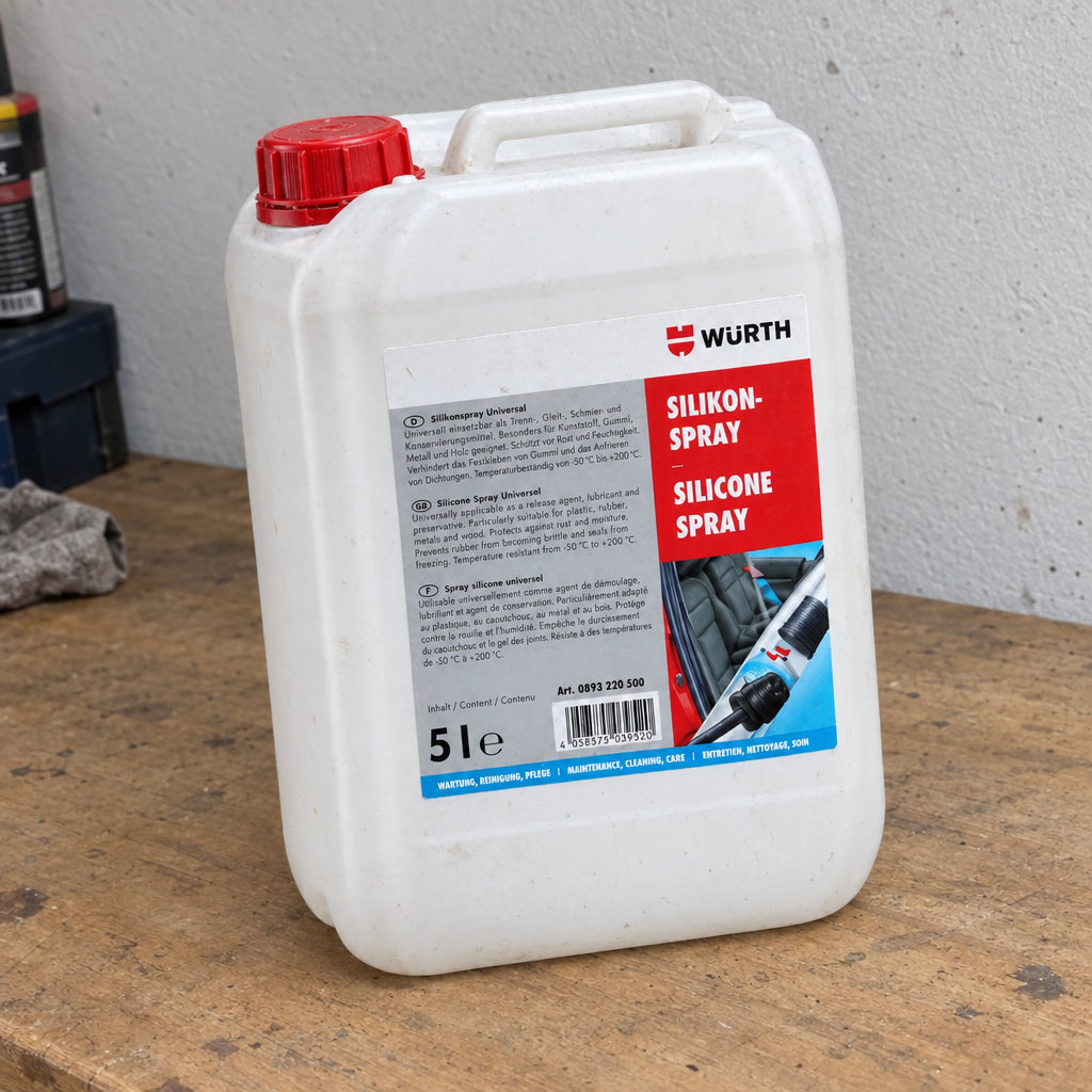 Five-liter container of universal silicone spray with a spray nozzle for easy application.