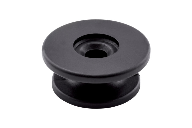 Black round plastic caps, 30mm diameter, packaged in a box of 50 units.