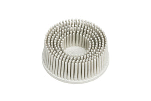 Reinigungsbürste REINIGBURST BRISTLEDISC mit ergonomischem Griff und speziellen Borsten für verschiedene Oberflächen.