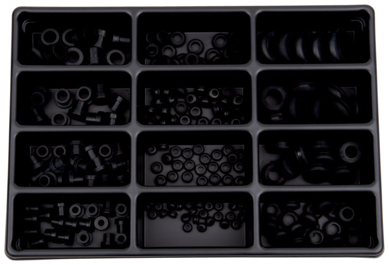 Sortiment aus verschiedenen Kabeltüllen aus Kunststoff in unterschiedlichen Größen zur Kabelorganisation.