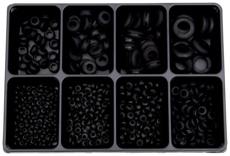 Set von Kabeltüllen in verschiedenen Größen und Materialien für Kabelorganisation.