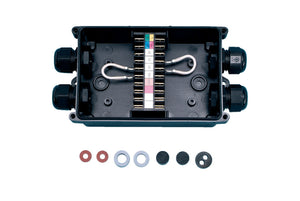 A complete outlet box with four input/output connections for electrical installations.