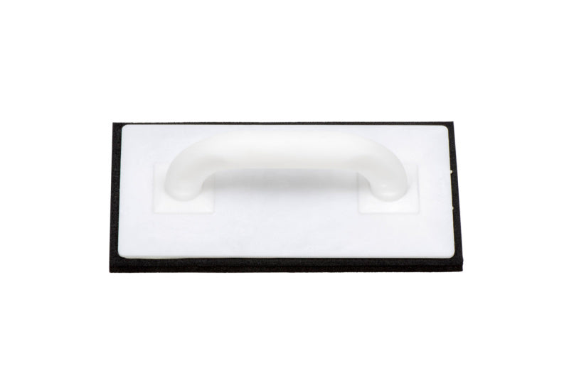 Gummy sponge for tile cleaning, featuring a textured surface for effective scrubbing.