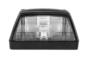 A rectangular vehicle license plate light with a clear lens and black housing.