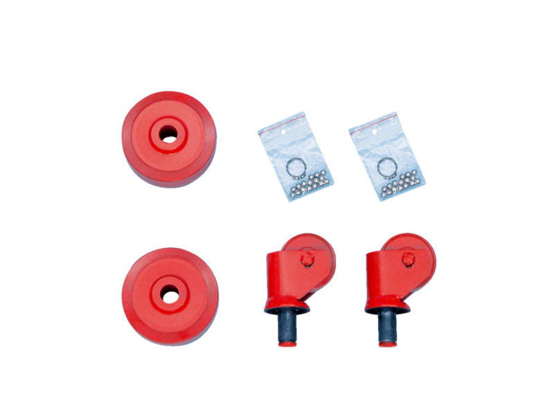 Set of four durable cast wheels for mobile jacks, designed for stability and smooth movement.