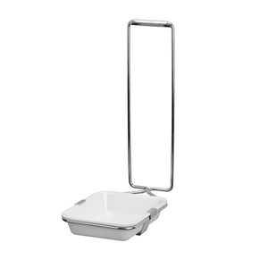 White enamel basin with a chrome holder for a dispenser.